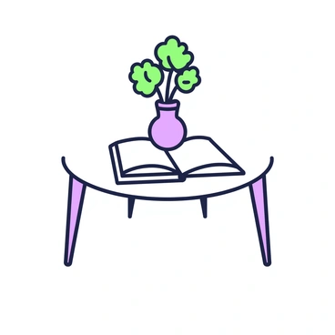 A small, round coffee table with a single vase and an open book