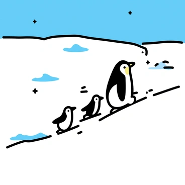 A small family of penguins is sliding down a steep icy slope, their bodies streamlined and sleek as they navigate the surface. The largest penguin, with a glossy black back and white belly, leads the way, followed closely by two smaller penguins. They create distinct marks on the pristine white snow as they glide. In the background, a vast snowy landscape stretches out, dotted with small snowdrifts and patches of shimmering ice under a clear blue sky. A few snowflakes are gently falling, adding to the wintery scene.