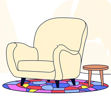 A plush fauteuil with a soft, cream fabric. The chair features rounded edges and slightly tapered legs. It is positioned on a colorful woven rug with a variety of geometric patterns in bright colors like red, blue, and yellow. The living room has warm lighting that enhances the cozy atmosphere. The walls are painted in a soft beige, and a small side table made of light wood is beside the fauteuil.