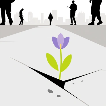 A small flower with delicate purple petals is growing through a crack in a gray, busy city sidewalk. The surrounding pavement is dotted with small pebbles and bits of debris. In the background, there are blurred silhouettes of tall buildings and people walking by, highlighting the contrast between nature and urban life. A few green leaves are visible around the flower, emphasizing its resilience in a harsh environment.