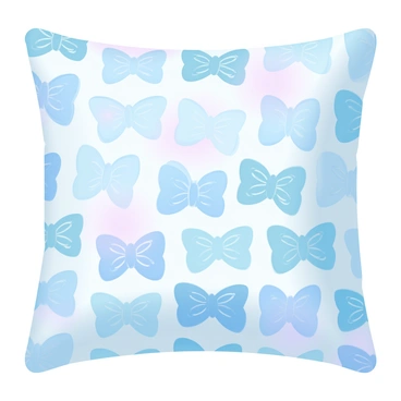 A decorative pillow with a printed bow tie pattern