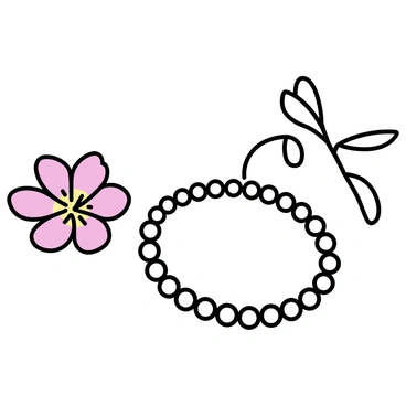 A simple pearl bracelet lying next to a blooming flower
