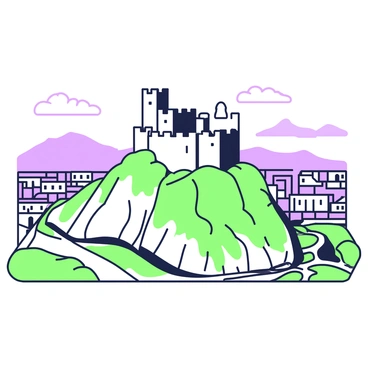 The historic Bastille fortress is situated atop a hill that dominates the skyline of Grenoble. The fortress features thick stone walls and prominent turrets, showcasing its architectural strength. Surrounding the fortress, there are rugged slopes dotted with patches of green vegetation. Below, the city of Grenoble is visible, with its buildings arranged in neat rows and winding streets. The background highlights the distant mountain ranges that frame the scene, creating a dramatic natural landscape. A clear sky is present, allowing sunlight to illuminate the fortress and casting soft shadows across the hillside.