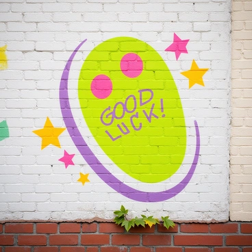 A colorful illustration of a rabbit's foot, depicted in a cartoon style, is spray-painted on a textured city wall. The rabbit's foot is shown in bright shades of green and pink, with exaggerated, playful features. Surrounding the main illustration are splashes of vibrant colors and stylized graffiti lettering that reads "Good Luck." The wall has hints of urban elements, like bricks and a few scattered leaves at the base, adding context to the street art setting.