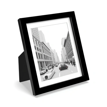 A simple black photo frame featuring a classic black and white photograph of a cityscape