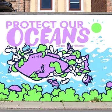 A large mural covers a city wall, illustrating the impact of plastic pollution on marine life. In the center, a large fish is depicted entangled in colorful plastic debris, showcasing its struggle. Surrounding the fish, there are various sea creatures like turtles and seabirds, with expressions of distress as they navigate through the litter. To the right, there is a contrasting image of a clean ocean, represented by flowing waves and a bright sun. Above the mural, the phrase "Protect Our Oceans" is prominently displayed in bold lettering. The mural is framed by green foliage at the bottom, blending the urban setting with nature.