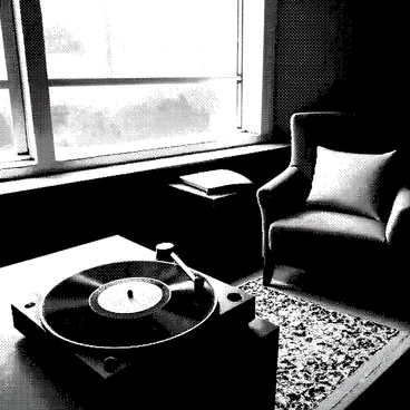A vintage record player is positioned on a wooden table, its turntable spinning a black vinyl record. The record label is clearly visible, displaying intricate details. Nearby, a cozy reading nook features a plush armchair with a soft cushion. A small side table holds an open book with pages slightly turned. Sunlight filters through a nearby window, creating a warm atmosphere around the scene. A decorative rug lies on the floor, enhancing the inviting ambiance of the nook.