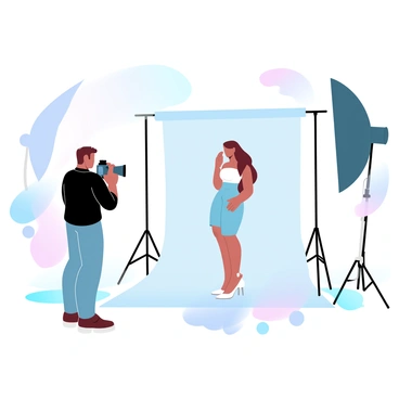 A photographer is standing in a well-lit studio, adjusting the settings on a professional camera. The photographer is wearing a dark shirt and is focused on a model positioned in front of a backdrop. There are various photography equipment pieces scattered around, including tripods and lighting setups. Soft gradient pastel colors fill the background, enhancing the creative atmosphere of the studio. The model is posed elegantly, wearing fashionable attire that complements the scene. A large, softbox light is illuminating the model, creating a pleasing effect.