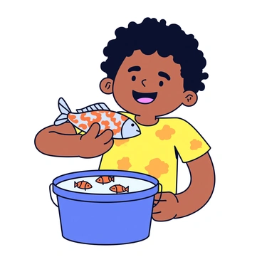 A toddler with curly hair is smiling widely while holding a small, shiny fish. The fish is vibrant with orange and silver scales and is glistening in the sunlight. The toddler is wearing a bright yellow t-shirt with playful patterns. In the background, there is a blue plastic bucket partially filled with water, and a few more small fish are swimming inside. The scene conveys a sense of joy and accomplishment.