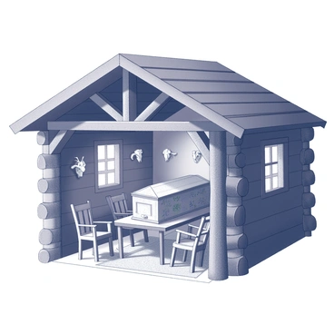 A rustic cabin constructed from dark timber logs. The structure features a slanted roof with exposed wooden beams. Inside, a hand-carved wooden coffin is prominently displayed as part of the decor, intricately designed with floral patterns along the sides. The cabin is furnished with mismatched wooden chairs and a sturdy table, all made of natural wood. There are animal skulls mounted on the walls, and the floor is covered with a woven rug. Soft light filters through small, square windows, illuminating the unique interior.