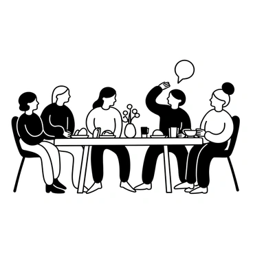 A group of people of various ages sitting around a large dining table. They are engaged in conversation, with some gesturing and others leaning in as they share stories. There are plates of food and drinks on the table, creating a warm atmosphere. An empty chair is positioned at one end of the table, noticeably unoccupied. Decorative items, such as a vase with flowers, are placed in the center of the table.