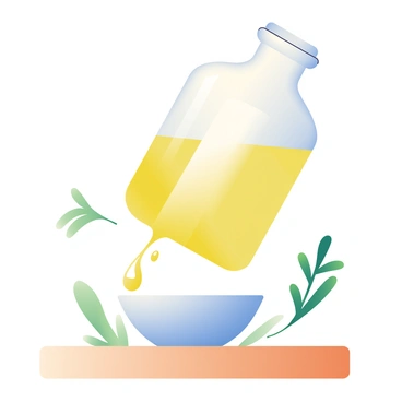A glass bottle filled with golden olive oil is tilted, and the oil is being poured into a small, white ceramic dish below. The oil glistens as it catches the light, creating a shimmering effect as it flows smoothly. The dish is placed on a wooden table, and there are small droplets of oil forming around the rim of the dish. The background features hints of fresh green herbs, enhancing the culinary theme of the scene.