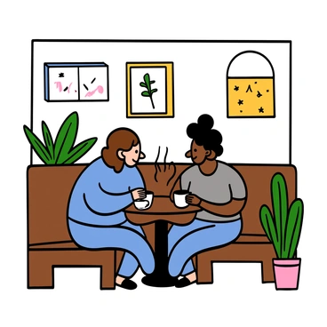 A cozy corner of a café with wooden furniture and soft lighting. Two friends are sitting at a small round table, deep in conversation. One friend has light skin and shoulder-length wavy brown hair, wearing a blue sweater. The other friend has medium skin and short curly black hair, dressed in a grey t-shirt. Each has a steaming cup of coffee in front of them, and they are leaning in towards each other, showing engagement and connection. The walls of the café are decorated with framed art and plants, creating a warm atmosphere.
