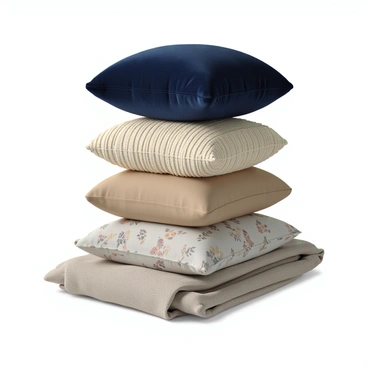 A cozy stack of pillows of various textures and sizes