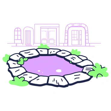 A small puddle formed between ancient cobblestones in an old town street