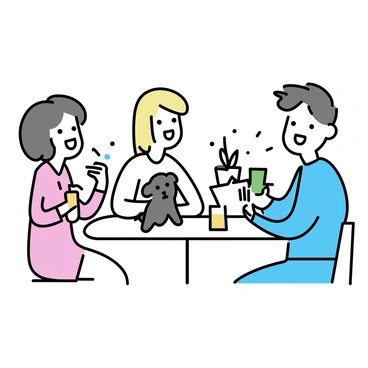 A group of three friends, two women and one man, are sitting at a round table in a café. The man, wearing a blue shirt and jeans, is holding a green drink. One woman, with long brown hair, is wearing a white blouse and laughing as a small fluffy puppy plays at her feet. The other woman, with short blonde hair, is wearing a pink dress and holding a glass of orange juice. A playful kitten is perched on the edge of the table, reaching for a napkin. The café has simple wooden furnishings and potted plants in the background.