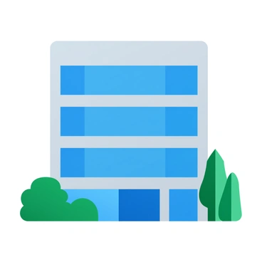 A sleek, modern Microsoft office building with large glass windows and angular architecture, surrounded by lush greenery including trees and shrubs.