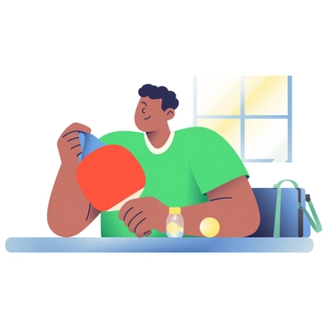 A person with light brown skin is focused on cleaning their table tennis paddle. They are holding the paddle in their left hand while using a blue cloth in their right hand to gently wipe the surface. The paddle has a red rubber face and a sleek wooden handle. The person is seated at a wooden table, and there is a bottle of paddle cleaner placed next to them. Sunlight is streaming in through a nearby window, illuminating the scene. The background features a sports bag and a couple of table tennis balls scattered on the table.