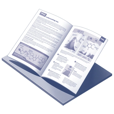 A pamphlet titled "Understanding PFAS" is displayed prominently on a wooden table. The pamphlet is open, revealing multiple pages filled with informative text and diagrams. Each page includes clear graphics illustrating the chemical structure of PFAS and its environmental impact. The layout is organized, with headings and bullet points that guide the reader. Various icons are used to highlight key points, enhancing the visual appeal of the content. The table surface is textured, providing a realistic setting for the pamphlet.