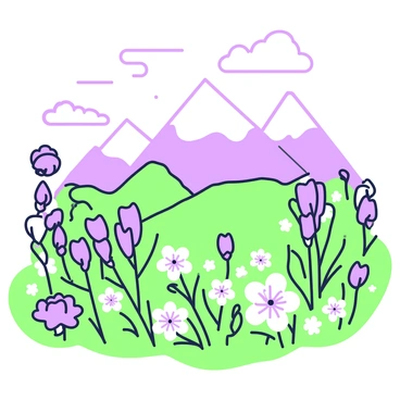 A colorful field of alpine flowers at the base of snow-capped mountains