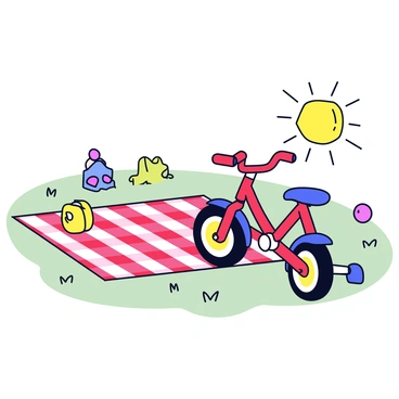 A toddler's bike with bright red paint and training wheels is parked beside a checkered picnic blanket. The blanket features a classic red and white pattern and is spread out on the grass. The sun is shining brightly, casting soft shadows on the blanket. In the background, there are a few colorful toys scattered around, adding to the playful atmosphere of a sunny day.