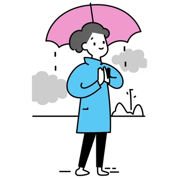 A person standing with hands in a "namaste" gesture under a large, round umbrella. The umbrella is bright red, contrasting with the grey, cloudy sky. The person is wearing a light blue raincoat, with drops of water visible on the fabric. Light rain is falling, creating small splashes on the ground around them. The setting is tranquil, with soft outlines of distant trees in the background, and puddles gathering at their feet.