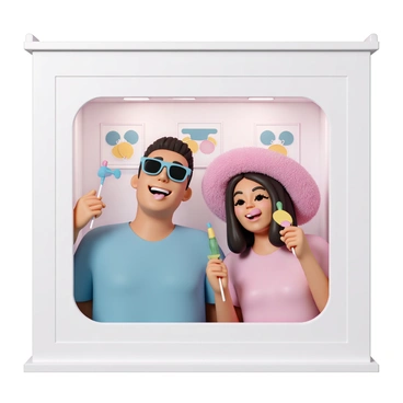 A couple inside a photo booth, both laughing and holding colorful props. The man is wearing a blue shirt and sunglasses, while the woman is dressed in a pink top and a big, fluffy hat. They are posing playfully, with the man sticking out his tongue and the woman making a funny face. The booth is adorned with bright lights, and the small window shows multiple frames of their silly expressions.
