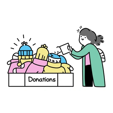 A stack of warm winter clothes, including knitted sweaters, thick scarves, and cozy hats, is placed neatly in a cardboard box. The box is labeled with the words "Donations" written in clear letters. In the background, a person wearing a green coat is gently placing another item into the box. The scene is organized and conveys a sense of community support and kindness.