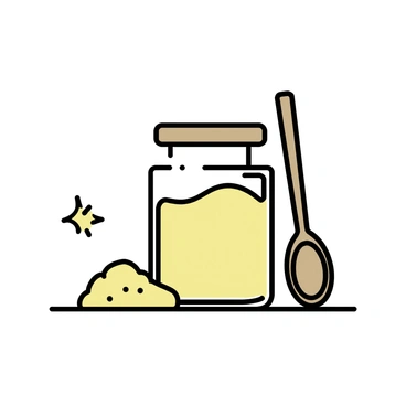 A transparent jar filled with finely ground "amla powder" is positioned on a simple kitchen counter. The jar has a wooden lid, maintaining a rustic appearance. Beside the jar, a "wooden spoon" rests against the counter, showcasing its natural grain and texture. The counter surface is light-colored, featuring subtle variations that add depth to the scene. Soft natural light illuminates the jar and spoon, enhancing the earthy tones of the amla powder.