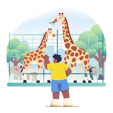 A black boy with short, curly hair is standing in front of a zoo enclosure. He is wearing a bright yellow t-shirt and blue shorts. The boy is excitedly pointing at a tall giraffe with a light brown coat and distinctive dark brown patches. The giraffe is bending its neck down towards the boy, protruding its long tongue to reach some leaves. In the background, other animals can be seen in separate enclosures, along with green trees and a clear blue sky overhead.