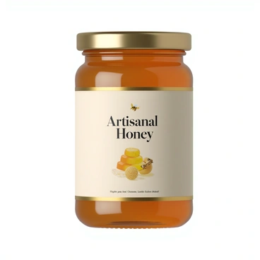 A clean and modern product label design for an artisanal honey jar. The label features a minimalist aesthetic with a soft color palette, primarily using shades of amber, cream, and white. It includes the words "Artisanal Honey" in elegant, contemporary typography at the center. There is a subtle illustration of honeycomb and a bee in the background, adding a touch of nature. The edges of the label have a delicate gold foil outline, enhancing its premium feel. The overall look is simple yet sophisticated, making it appealing and eye-catching on the shelf.