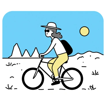 A woman, wearing a wide-brimmed hat and sunglasses, is riding a rugged bicycle across a vast desert landscape. The desert features rolling sand dunes and sparse patches of dry shrubs. The woman is dressed in a light-colored, breathable outfit, and she has a backpack secured to her bicycle. The bright sun is shining in a clear blue sky, casting distinct shadows on the ground. In the distance, jagged rock formations rise against the horizon, completing the arid scenery.
