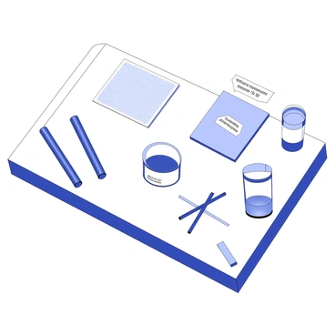 A table is set up to showcase various conductive materials. On the table, there are metal rods and sheets, each with distinct textures and shapes. Next to them, a small container filled with graphite powder is placed, with a few graphite sticks lying beside it. A glass jar holds a liquid conducting solution, which appears to be slightly viscous. Each material is labeled with clear tags, providing information about their conductivity properties. The arrangement is organized in a way that emphasizes the differences among the conductive materials.