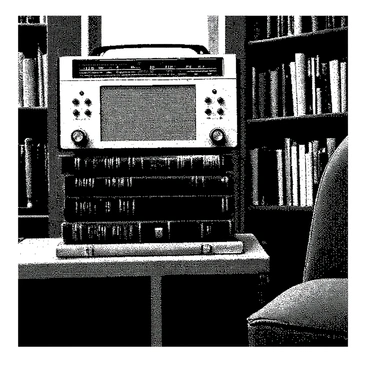 A vintage radio is perched on top of a stack of classic novels in a cozy library corner. The radio features rounded edges and a textured surface, with knobs and dials prominently displayed on its front. The classic novels are bound in various worn leather covers, showcasing the titles embossed in gold lettering. The library corner is adorned with wooden bookshelves filled with more books, and a small window lets in soft light, highlighting the scene. A plush armchair sits nearby, inviting one to sit down and enjoy a good read.