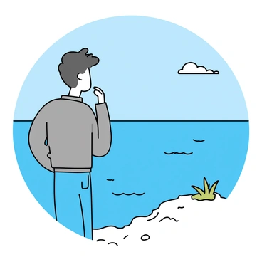 A man with short, dark hair is standing on a rocky outcrop, gazing thoughtfully towards the distant ocean. He is wearing a grey jacket and blue jeans. The ocean stretches out before him, with gentle waves lapping at the shore. In the background, a clear blue sky meets the horizon, while a few wispy clouds float above. There are hints of green vegetation on the rocky ledge where he stands.