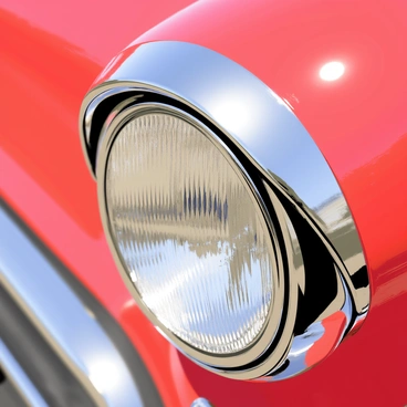 A close-up illustration of a shiny hubcap from a classic car. The hubcap is round and reflective, with intricate designs etched into its surface. Light glints off the polished metal, creating highlights and shadows. The background features a blurred view of the classic car's body, showcasing its vibrant color and vintage style. The hubcap is the central focus, emphasizing its glossy finish and detailed craftsmanship.
