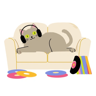 A fluffy gray cat with bright green eyes is wearing oversized black headphones. The cat is comfortably lounging on a soft, light-colored sofa. Surrounding the cat are various colorful vinyl records scattered across the floor, some leaning against the sofa and others stacked in a small pile. The room is cozy, with a warm light illuminating the scene, highlighting the playful demeanor of the cat as it relaxes amidst its collection of music.