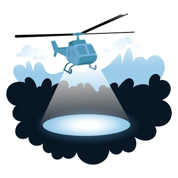 A helicopter hovers above a dark area, with its searchlight illuminating a small portion of the ground below. The helicopter features a sleek, military design with rotor blades in motion. Surrounding the illuminated area is dense foliage, casting shadows in the surrounding darkness. In the background, faint outlines of trees and rugged terrain are visible under the night sky. The scene captures the tension of a night mission, with the light creating a stark contrast against the dark environment.