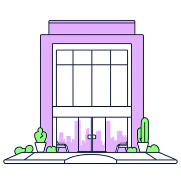 A minimalist office building is standing tall with clean lines and a sleek structure. The building features a large glass facade that reflects the surrounding environment. The entrance is wide and framed in a simple manner, leading to a spacious lobby visible through the glass. On either side of the entrance, there are neatly arranged planters with green plants. Above, the roofline is flat and unobtrusive, enhancing the streamlined look of the building. The surroundings include a paved area with a few benches and minimal landscaping.