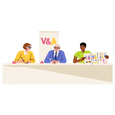 A panel of three judges sitting at a long rectangular table, each with a focused expression. The judges are examining colorful illustrations laid out before them. One judge is a woman with glasses and short brown hair, holding a red pen and taking notes. The second judge is an elderly man with gray hair, wearing a blue suit and leaning forward to closely inspect an illustration. The third judge is a young man with curly black hair, reviewing an illustration on a clipboard. A large banner in the background reads "V&A Awards," adding context to the setting. The room is bright and well-lit, enhancing the concentration of the judges.