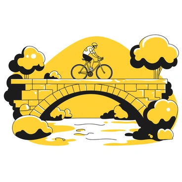 A cyclist riding a road bike is crossing an old stone bridge that arches over a flowing river. The cyclist is wearing a yellow helmet and a cycling jersey with black accents. The bridge features weathered stones and a textured surface, showing signs of age. Below the bridge, the river flows with gentle ripples, reflecting the surrounding environment. On either side of the bridge, lush greenery lines the riverbanks, with trees partially shading the scene. The sky is clear, providing a bright backdrop for the activity.