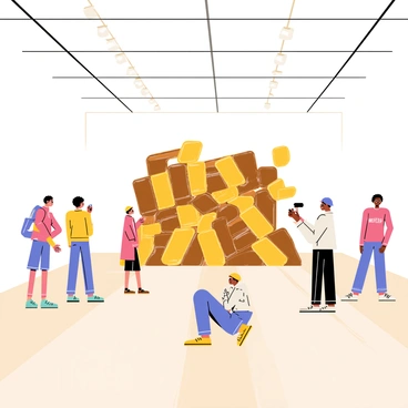 An art gallery with an installation featuring Snickers bars as a centerpiece.