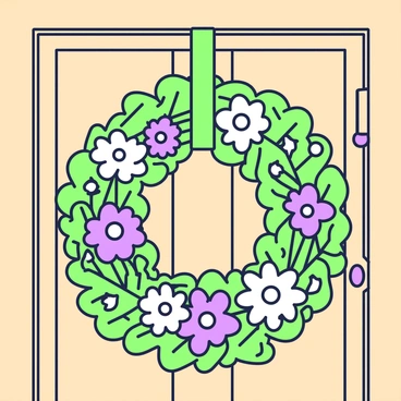 A seasonal wreath made from fresh flowers and greenery is hanging on a wooden door. The wreath is circular, filled with vibrant green leaves and assorted flowers in various shapes and sizes. Some flowers are blooming, showing their petals prominently, while others are tightly closed. The greenery extends outward from the center, creating a lush appearance. A simple green ribbon is tied at the top, allowing the wreath to hang securely from a nail. The door's texture is visible, showcasing its wood grain and natural finish.